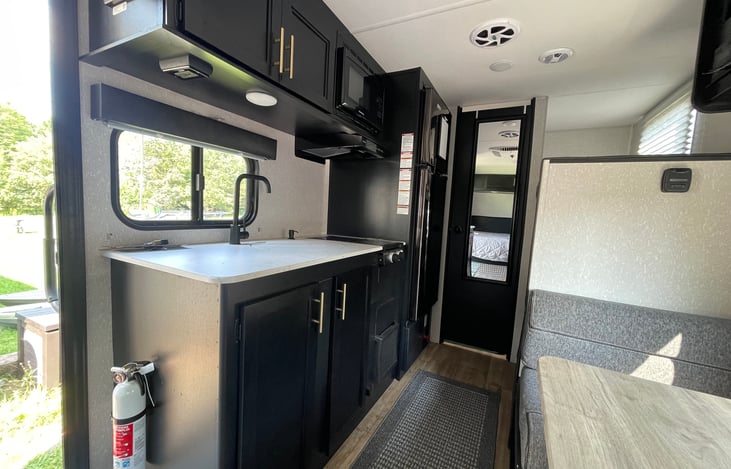 Kitchen, indoor floor mat, fire extinguisher