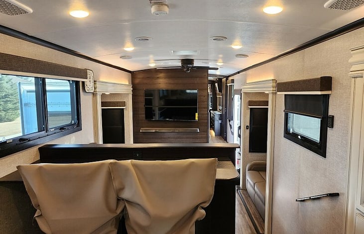 View from the center of the kitchen looking over the two seat breakfast bar into the living room.