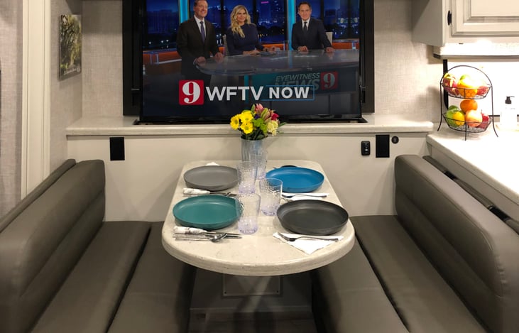 Pop-up big screen TV for viewing from the main living and dining room area. When not in use, simply push a button to lower the TV and enjoy the view outside.