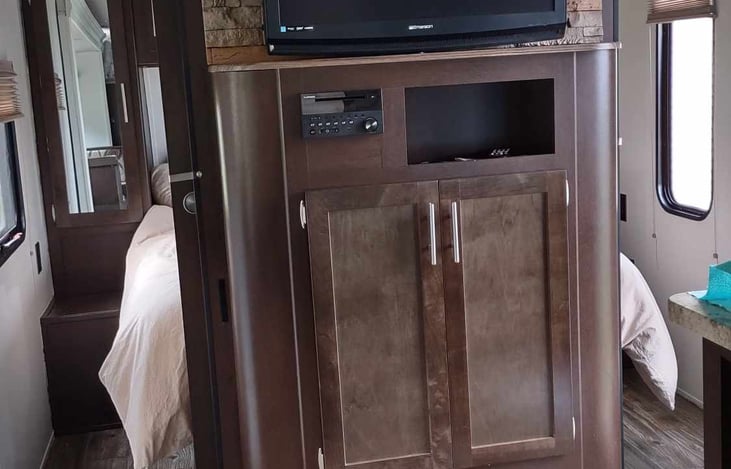 Entertainment Center with a new smart TV
Furrion stereo system with bluetooth, DVD player, AM/FM radio, including outside speakers