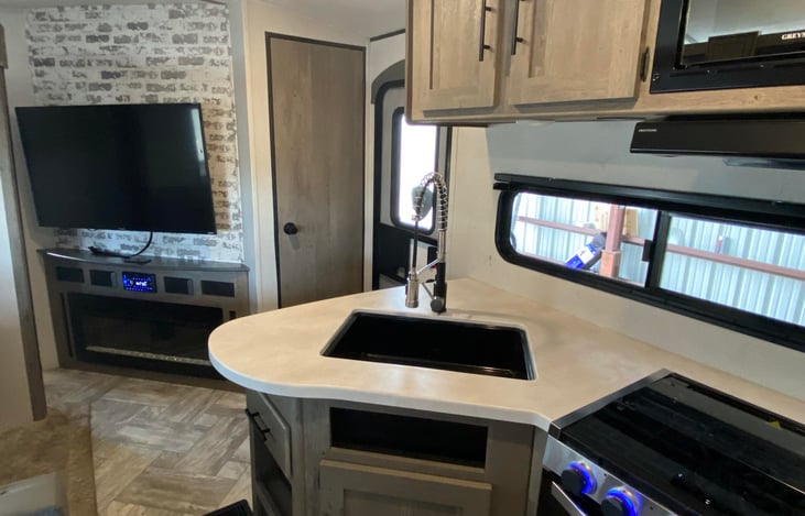 Kitchen with Fireplace and TV