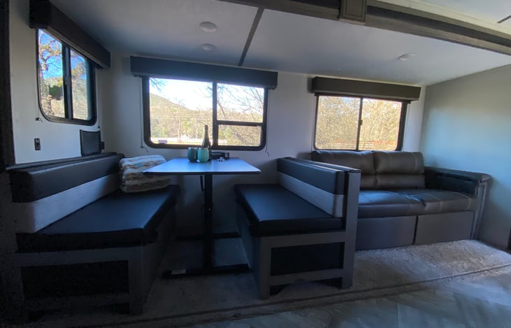 Both dining table and couch fold into beds. Each could sleep two small kidos comfortably.