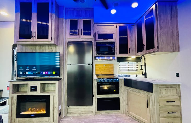 Entertainment system and Kitchen Area.