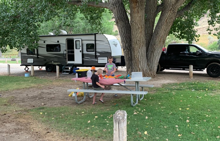 Our two sons enjoying the shade at a fun day at Boysen State park in Wyoming.