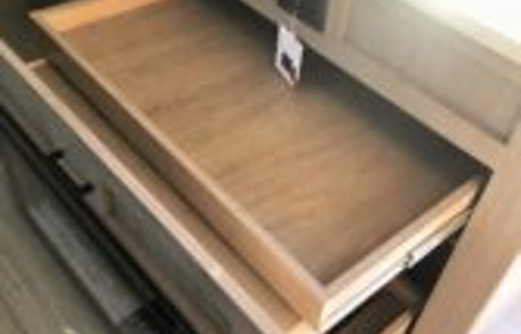 storage drawer behind fire place