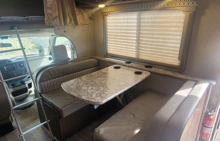 Main dinning has seat belts and also converts to sleeping area