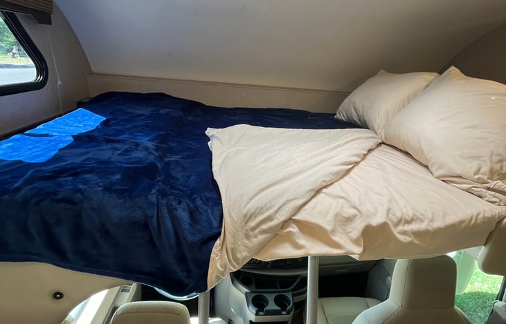 Loft bed showing included bedding. This bed sleeps two, and is a fun place for kids!