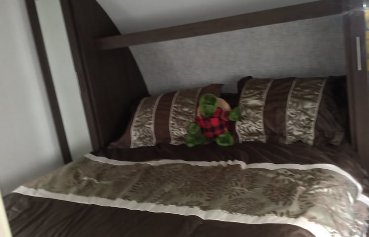 Camper queen in the master bedroom.