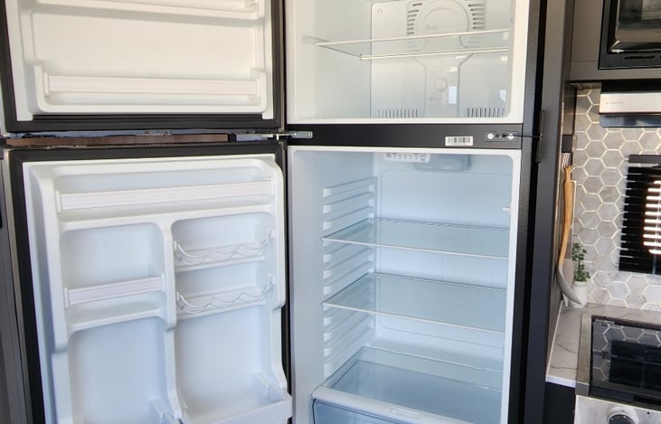 Large fridge/freezer with plenty of space to hold all of your goodies!