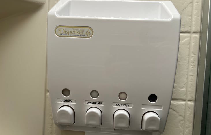 Push button shower dispenser.