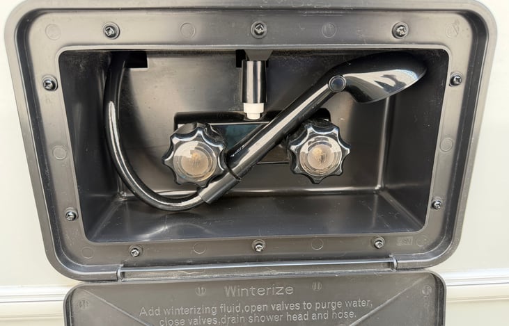 Exterior shower for rinsing off muddy shoes, washing pets or showering outside.