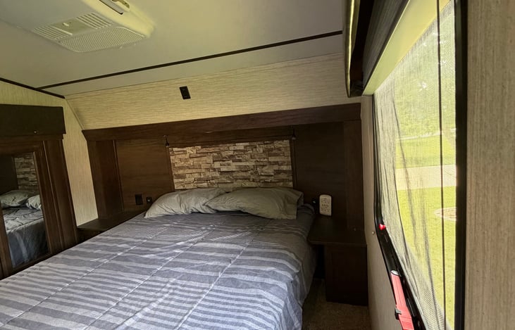 Queen bed with 8" gel bed for optimal comfort pillows and bedding provided.
