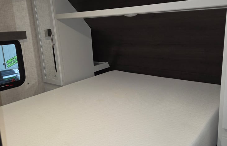 Large front sleeping area with thicker queen mattress