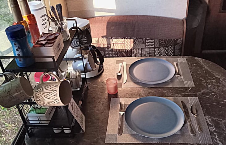 Dinette Table with a Coffee station. The booth dinette by a big picture window let you enjoy the views.