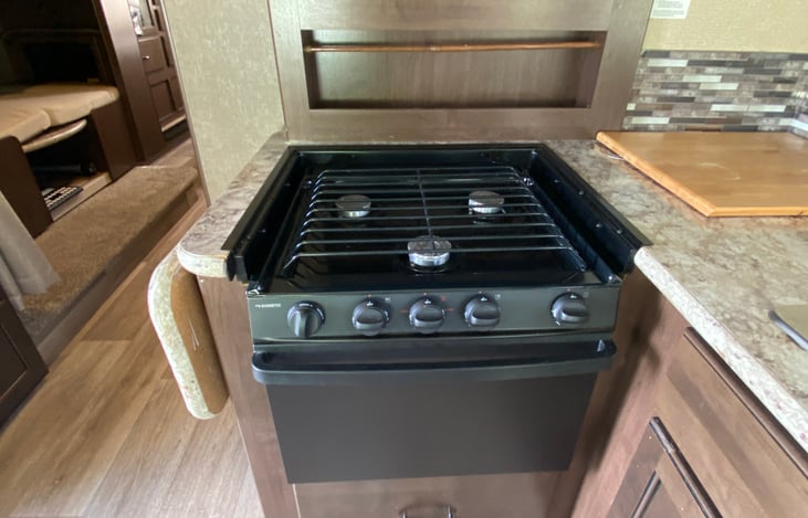 Three burner stove with oven and microwave