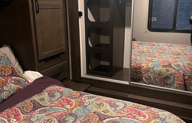 lots of storage in the bedroom closet and above bed