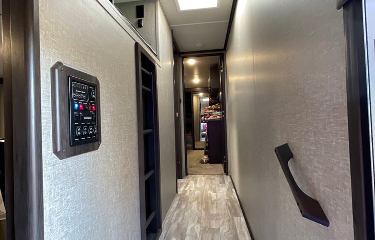 Hall way leading to master suite with King size bed and full closet. Also access to loft bunk and master bath