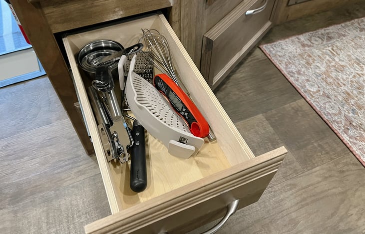 Some of the included amenities including can openers, thermometers, cheese graters and more!