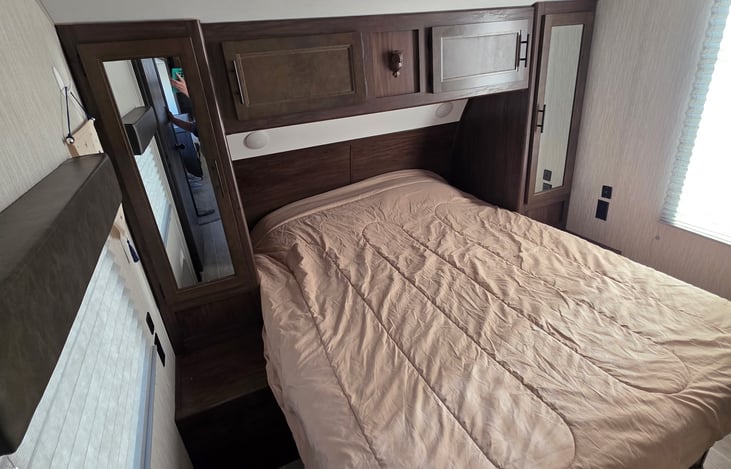 Side tables and mirrors on each side of the bed. Don't forget to say hi to our mascot, the owl above the bed.