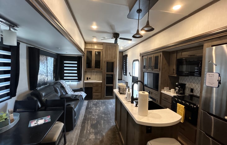 Another angle of the kitchen, dinette, and living room