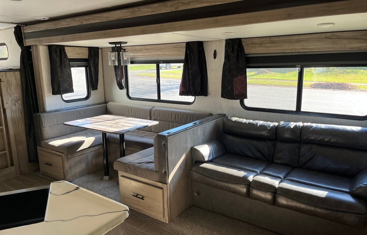 The dinette can break down into a small queen size bed and sleep 2 people. The jack knife sofa can break down into a small bed as well.