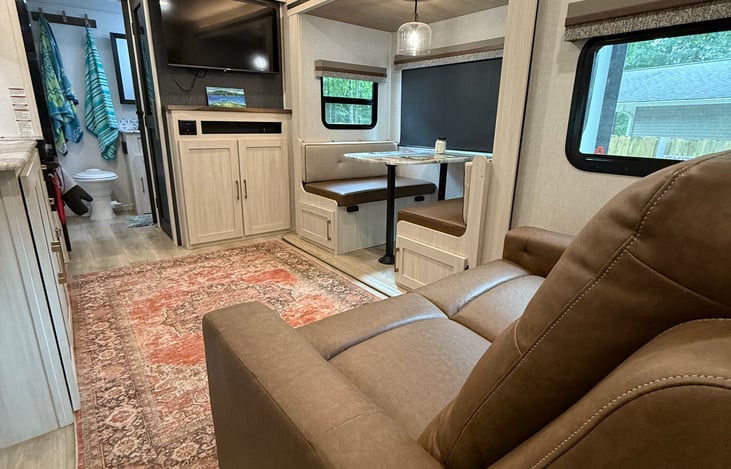 A nice four seat dinette that converts into a bed. Along with duel recliners to sit in and watch the smart TV on a rainy day.