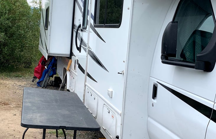 We provide you with one folding 8 foot table and chairs. This is how we use it when camping.