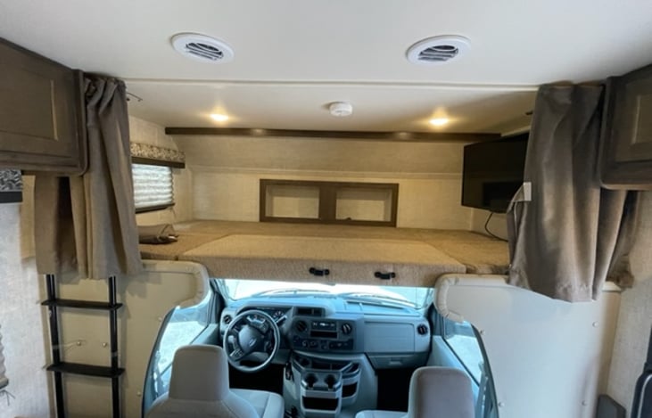 Over cab sleeping with privacy curtain.