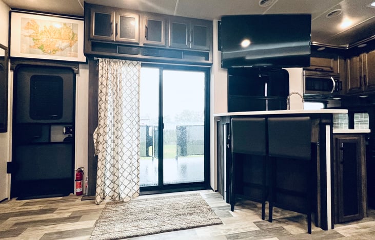 Living room area with a sliding door to the patio.