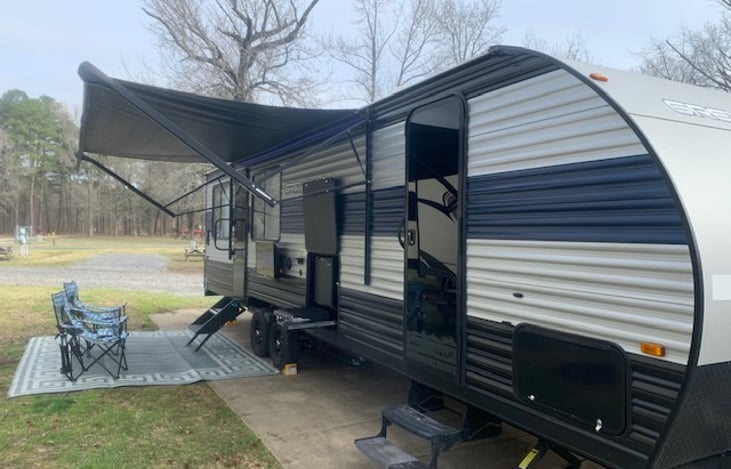 Motorized Awning. Exterior entertainment system with outdoor kitchen