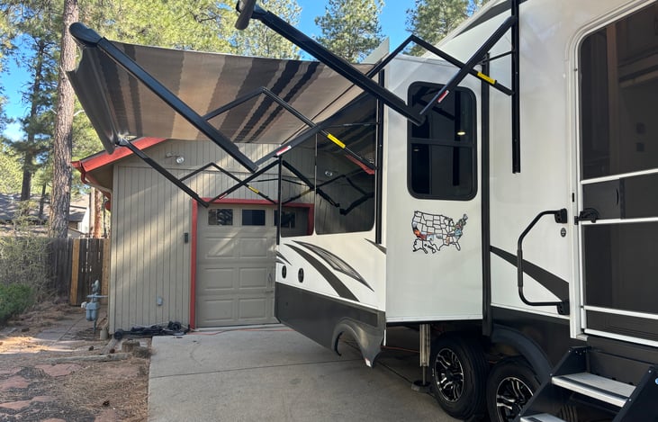 Outdoor sitting area with external speakers under 
 retractable awnings.  Whether this is a glamping trip or a true boondocking adventure, our RV will make your trip a delight.