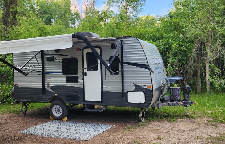 This is the camper in the beautiful camping area of Wolf Flats, ID. It is a tiny bit dirty but we wash it down and clean and sanitize the interior after each rental.