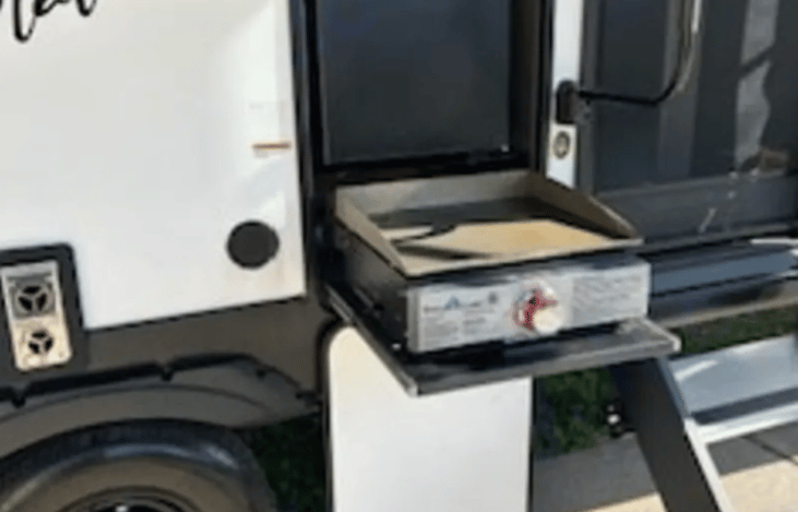 Enjoy outdoor entertaining with this outdoor grill and refrigerator.  While entertaining, you can listen to the stereo or hook up an outdoor tv.  All in the shade provided by the huge canopy!