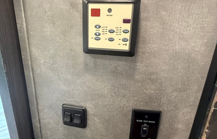 RV thermostat for heating and cooling of the coach.