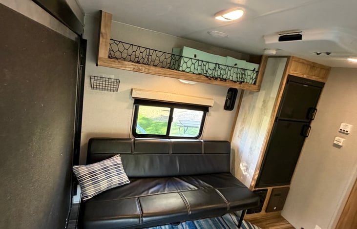 Extra overhead storage space for clothes, bags, and personal items to help keep your camper organized.