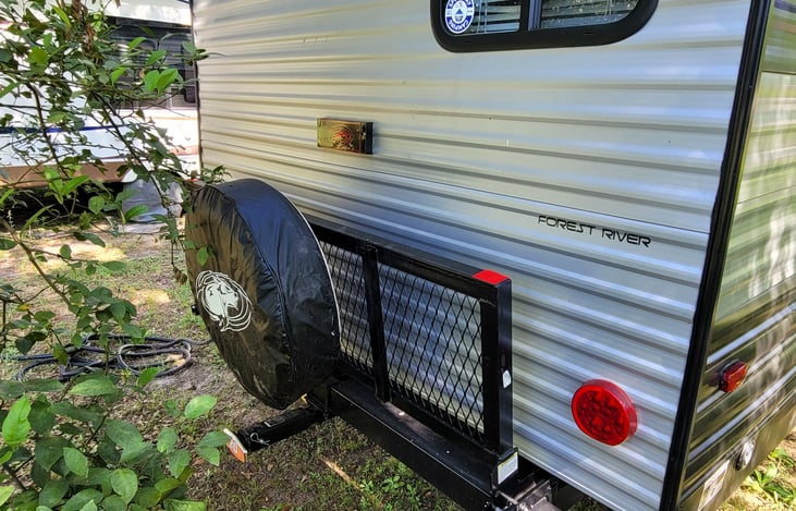 Tray on back carries up to 250 # (including spare tire). This is usually where I mount a generator. There's also an extension here for a receiver to pull another trailer - but no wiring for lights.