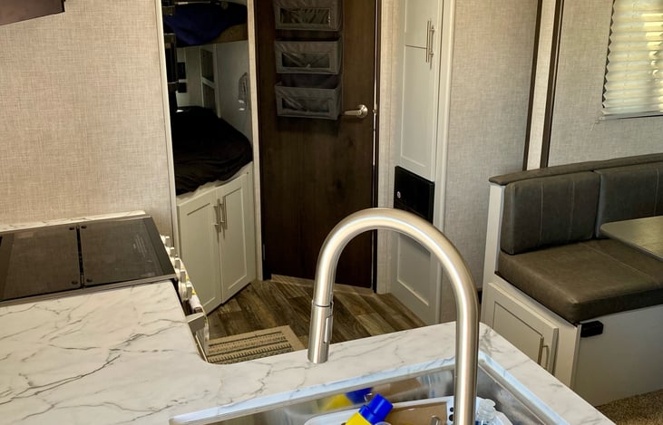 U- shaped dinette with a big pantry next to it.