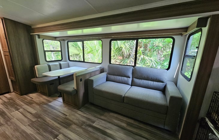 Very spacious living space with Comfortable Sofa which converts to a Queen bed, the Banquet has under cushion storage and convert to sleeper as well. Additional Pantry behind the dinning area.