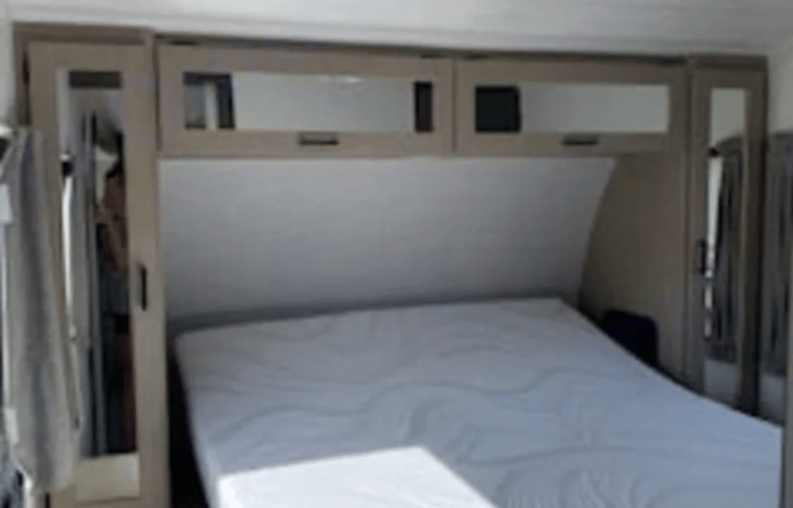 Master has a custom queen versa tilt bed with brand new mattress, side storage units and a spacious closet.