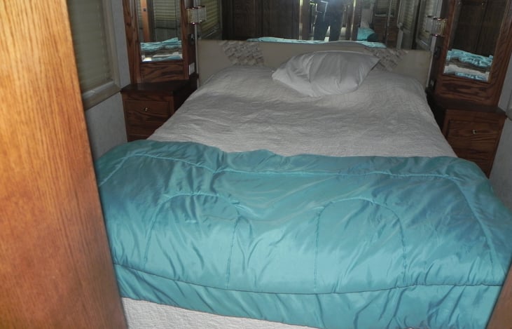 this is the rear bedroom with a queen bed