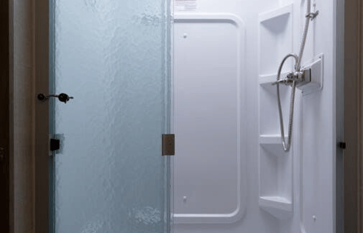 Shower can easily fit 2 people including a 6'8" adult (I know personally from experience)