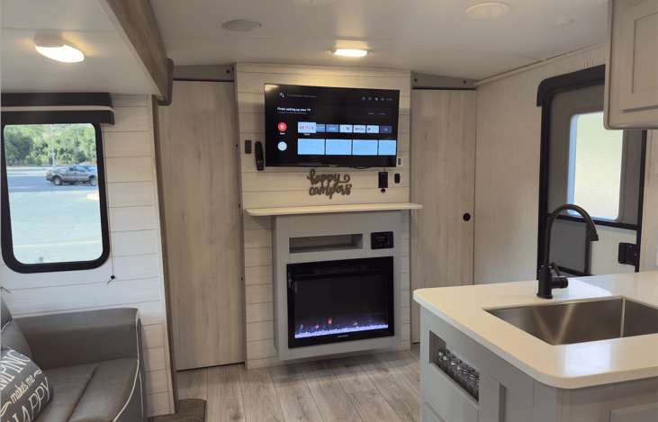 Lounge Area with 50 in smart tv and electric fire place