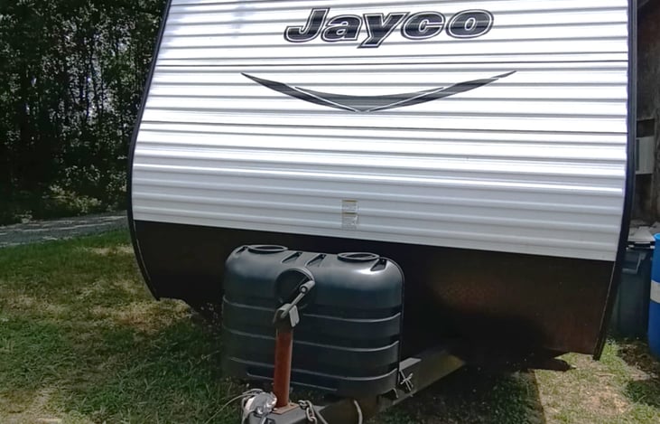 Front of Jayco with Propane Tanks