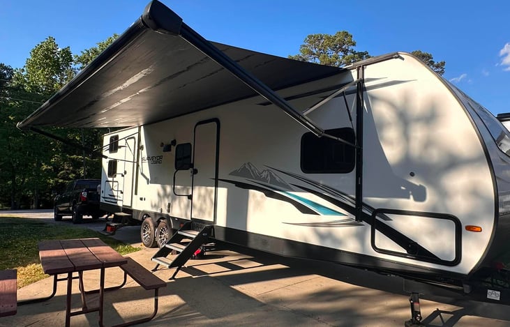 Awning out.  Please always close awning when you leave the campsite or there is bad weather.