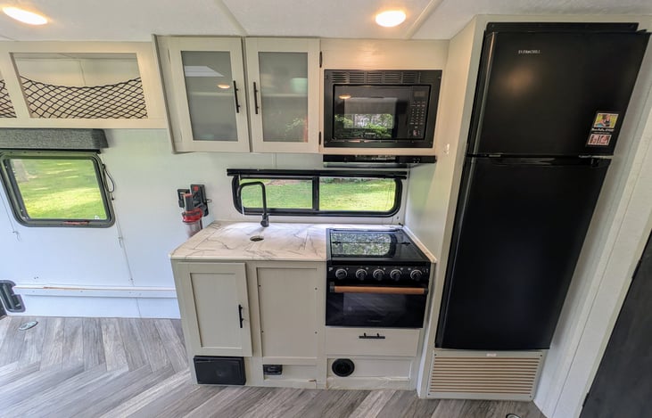Spacious galley with large windows allow for an abundance of natural light and plenty of room for your gear or toys.