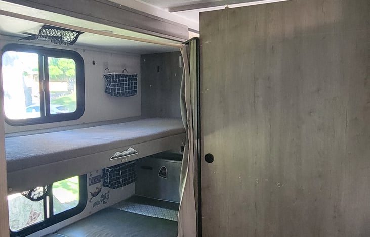 Enjoy privacy from the primary suite and the Bunkhouse with a sliding door.
