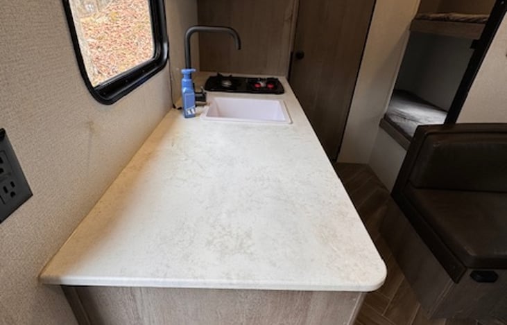 Plenty of counter space next to an outlet so you can bring a crockpot or coffee maker, prep meals, and charge your phones.