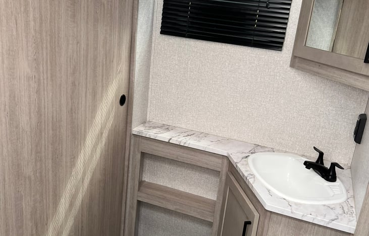 Bathroom with the other door closed.