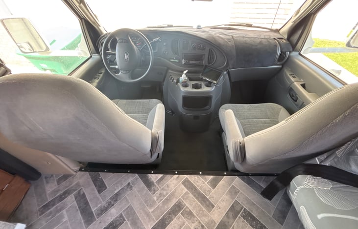 Cab is exactly the same as a 15 passenger van. This rig is super easy to drive.