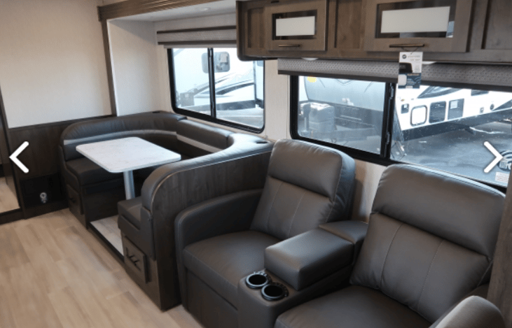 Dining table converts to bed, 2 reclining chairs have heat/massage